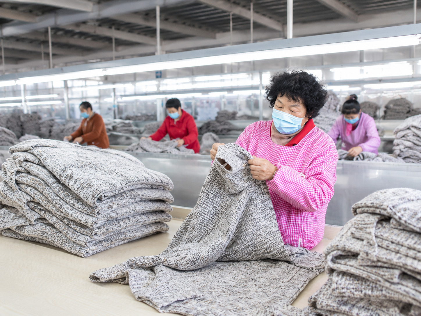 Knitwear quality control inspection and workmanship review at factory