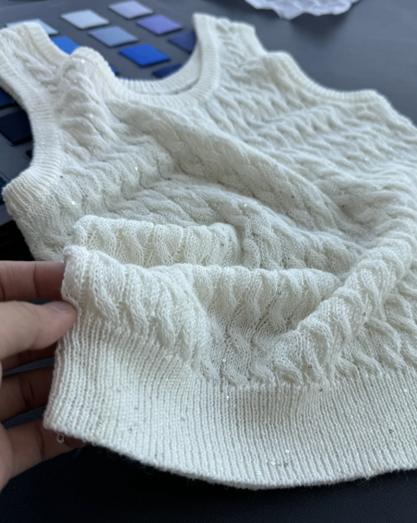 Yarn selection affecting sweater manufacturing cost for custom knitwear production
